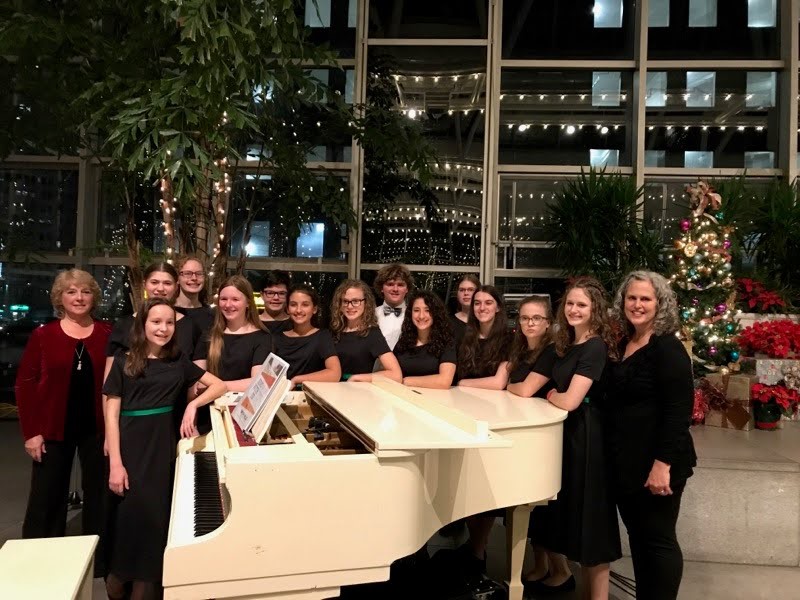 South Hills Children's Choir at white grand piano